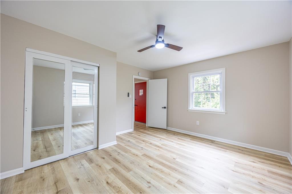 552 Stephens Street Ambridge, PA 15003 - Photo 10 of 21 a view of an empty room with wooden floor and a window