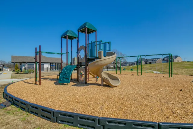 swimming pool view with a sitting space