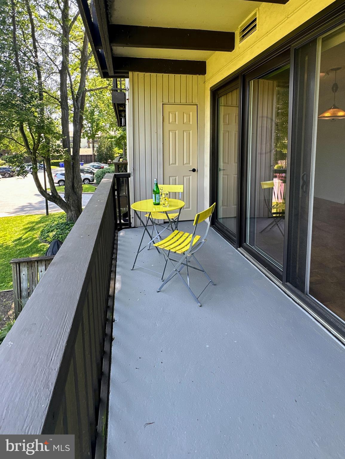 10053 Windstream Drive, Unit 3 Columbia, MD 21044 - Photo 38 of 57 a balcony with chairs and table