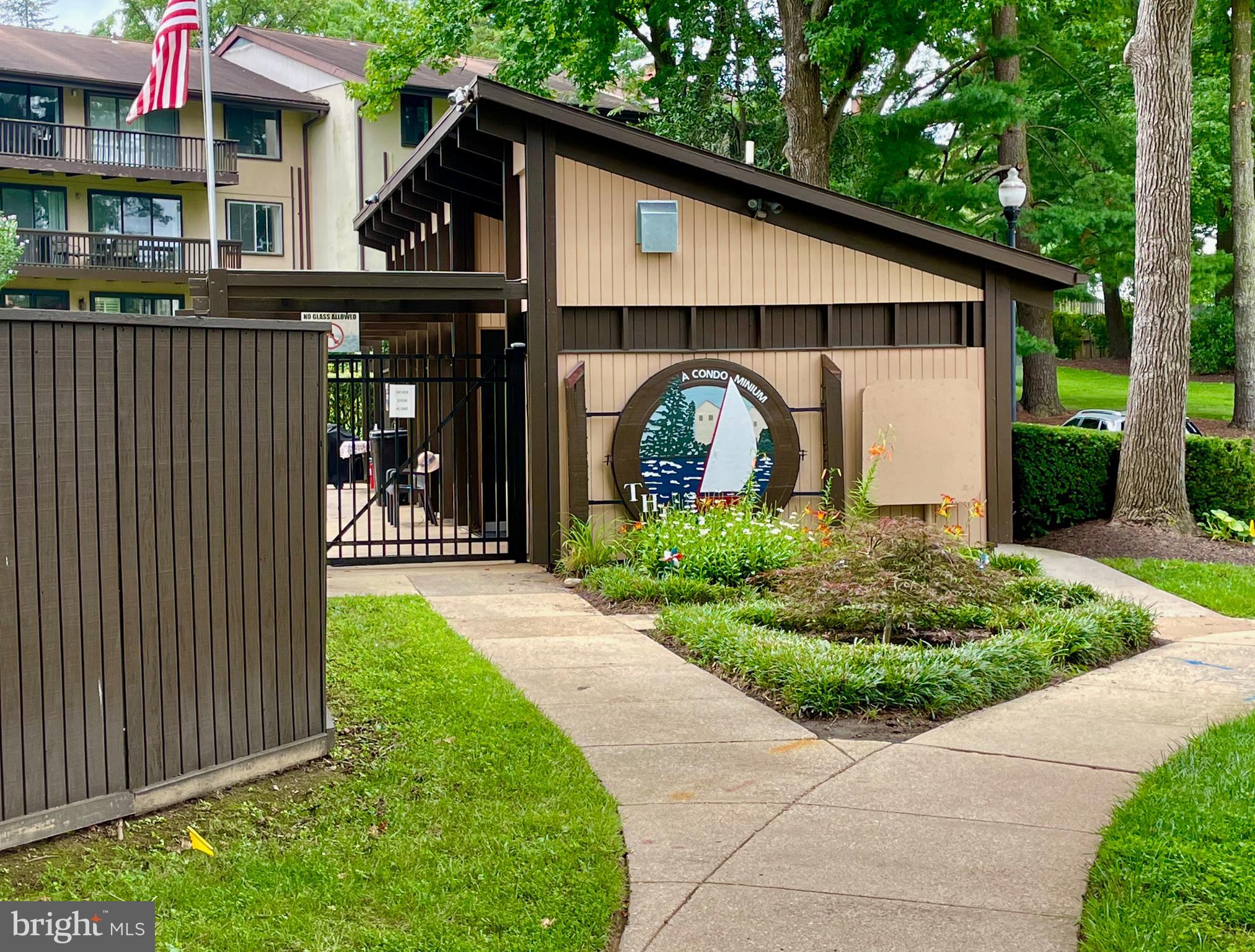 10053 Windstream Drive, Unit 3 Columbia, MD 21044 - Photo 54 of 57 a front view of house with pathway and yard