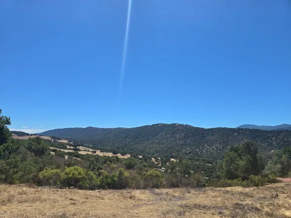a view of a mountain with a outdoor space