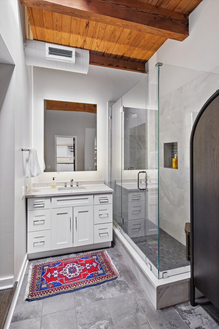 2222 North Racine Avenue, Unit 16 Chicago, IL 60614 - Photo 17 of 32 a bathroom with a sink shower and a mirror