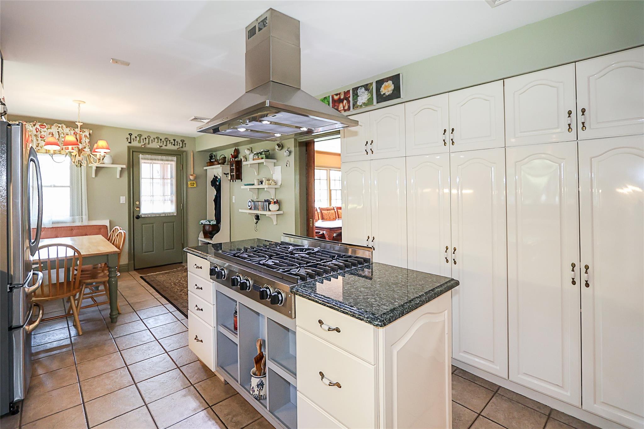 19 Marietta Road Glen Cove, NY 11542 - Photo 16 of 46 a kitchen with stainless steel appliances granite countertop a stove a sink and a refrigerator