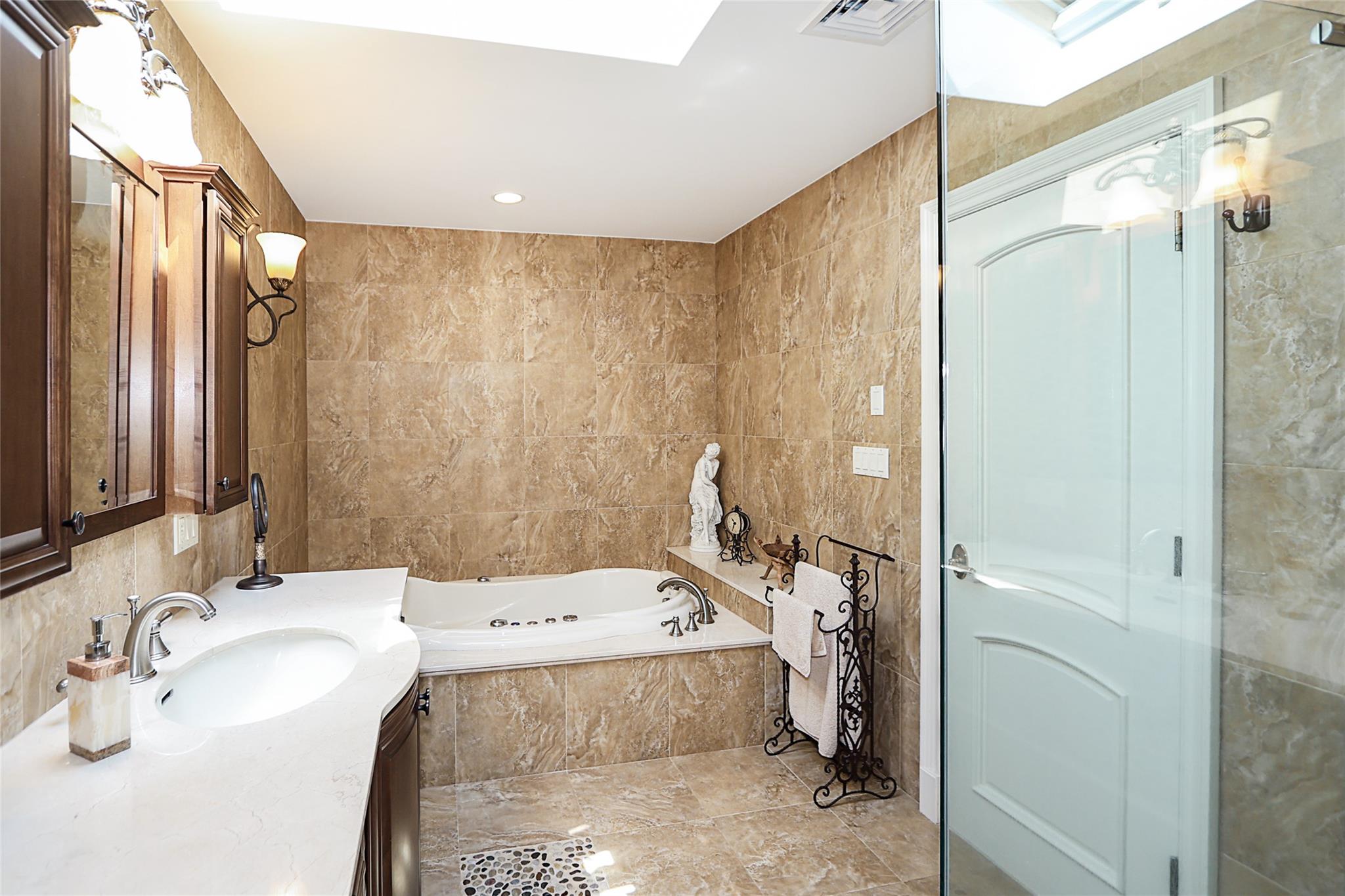 19 Marietta Road Glen Cove, NY 11542 - Photo 21 of 46 a bathroom with a sink and a mirror