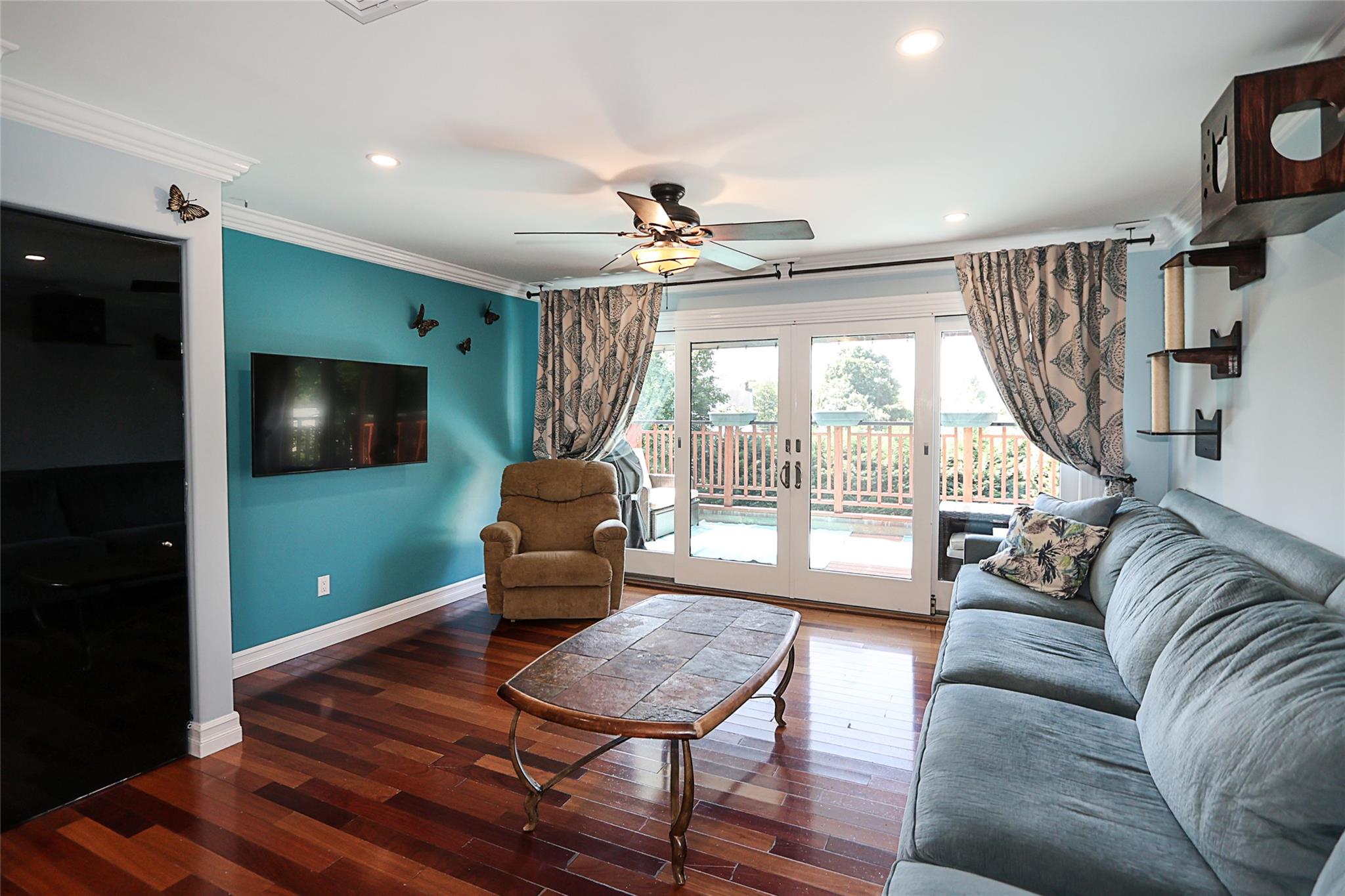 19 Marietta Road Glen Cove, NY 11542 - Photo 28 of 46 a living room with furniture and a flat screen tv