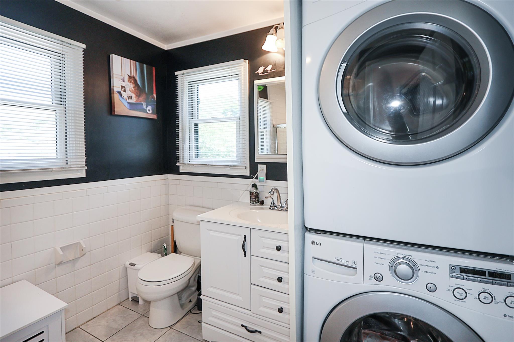 19 Marietta Road Glen Cove, NY 11542 - Photo 35 of 46 a bathroom with a toilet sink and mirror