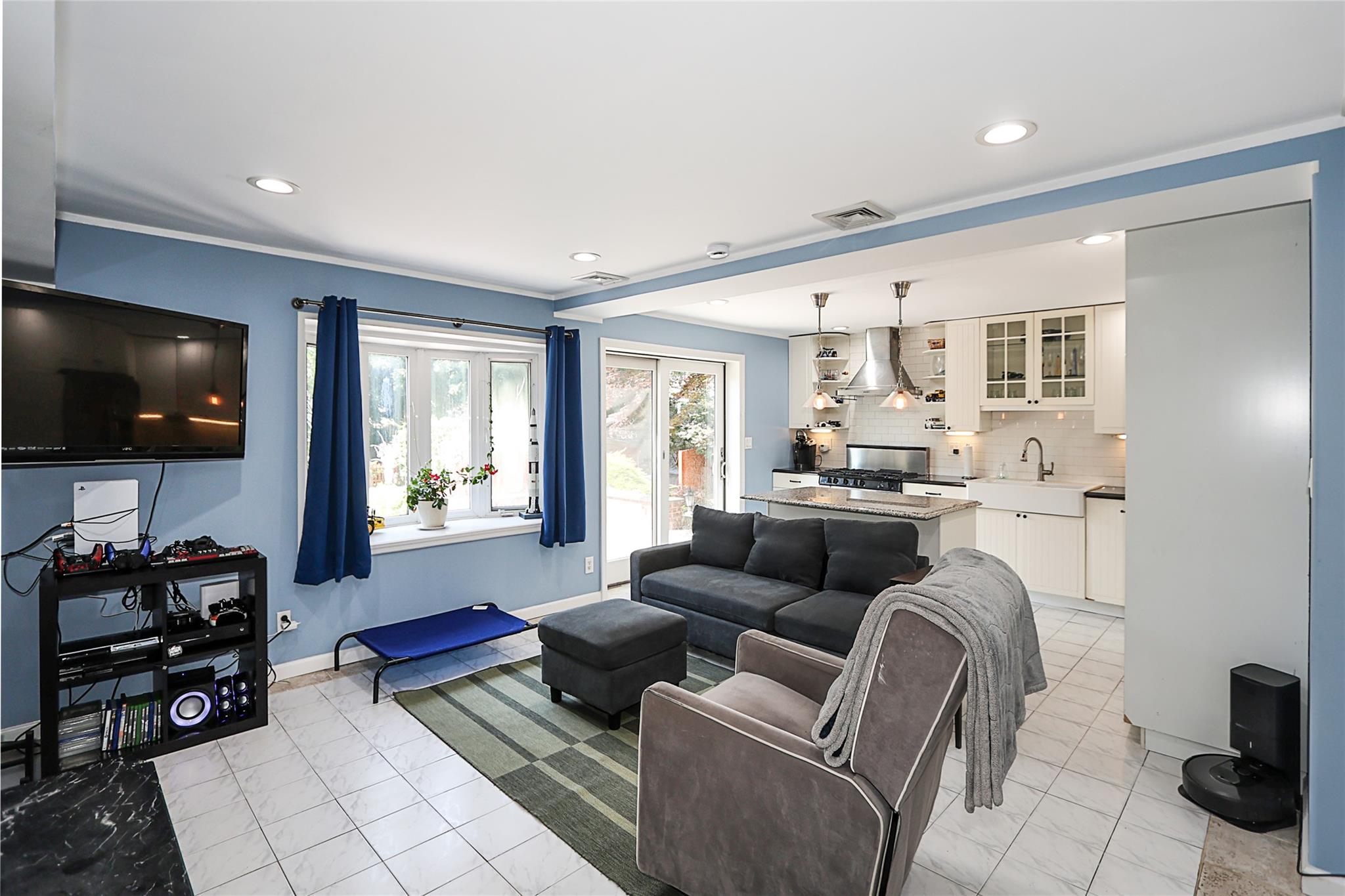 19 Marietta Road Glen Cove, NY 11542 - Photo 37 of 46 a living room with furniture and a flat screen tv
