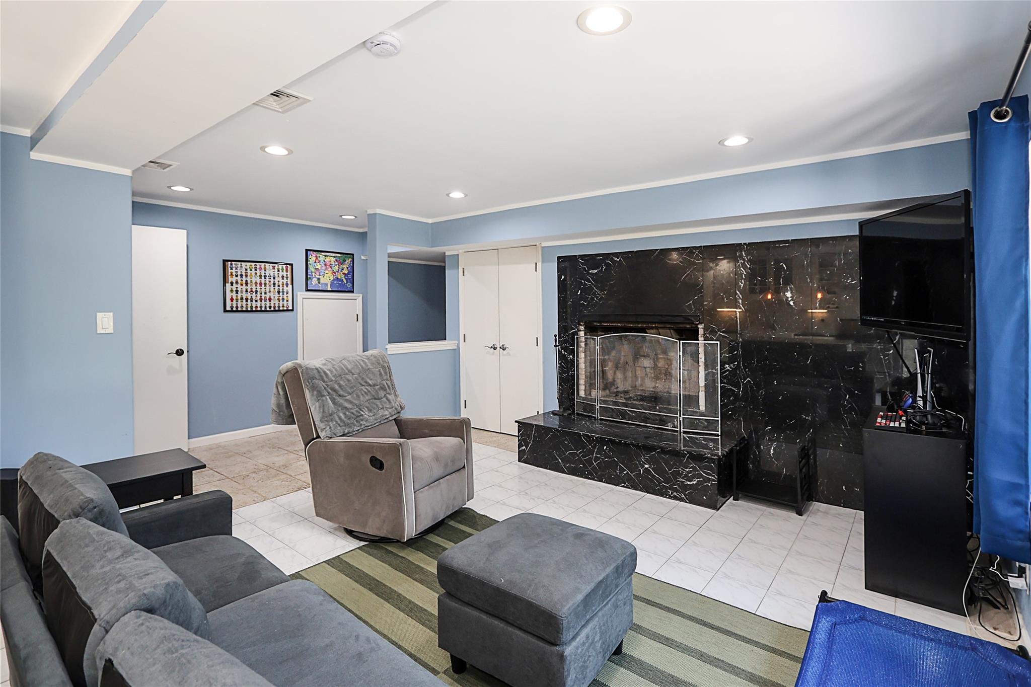 19 Marietta Road Glen Cove, NY 11542 - Photo 38 of 46 a living room with furniture and a flat screen tv