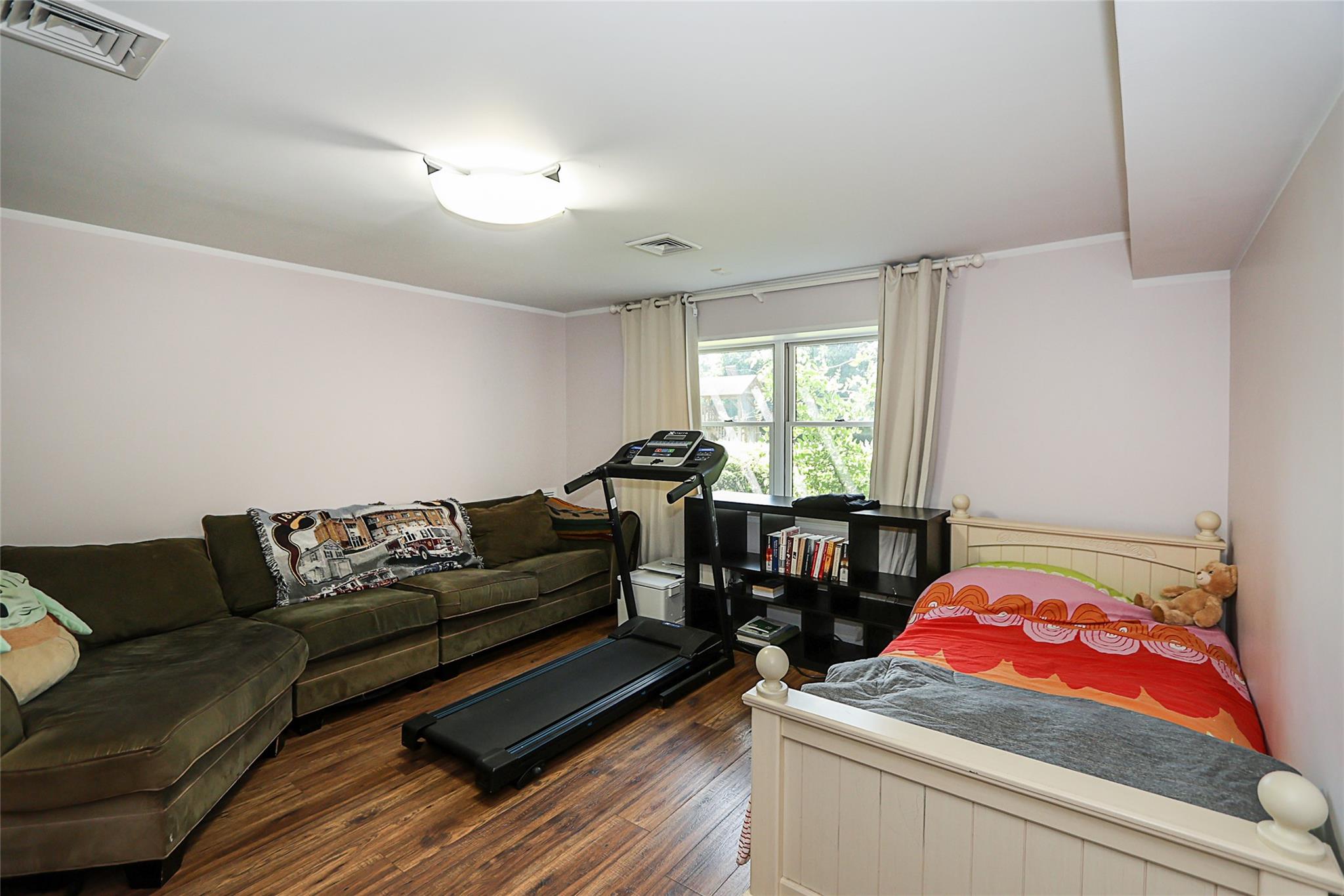 19 Marietta Road Glen Cove, NY 11542 - Photo 41 of 46 a living room with furniture and a window