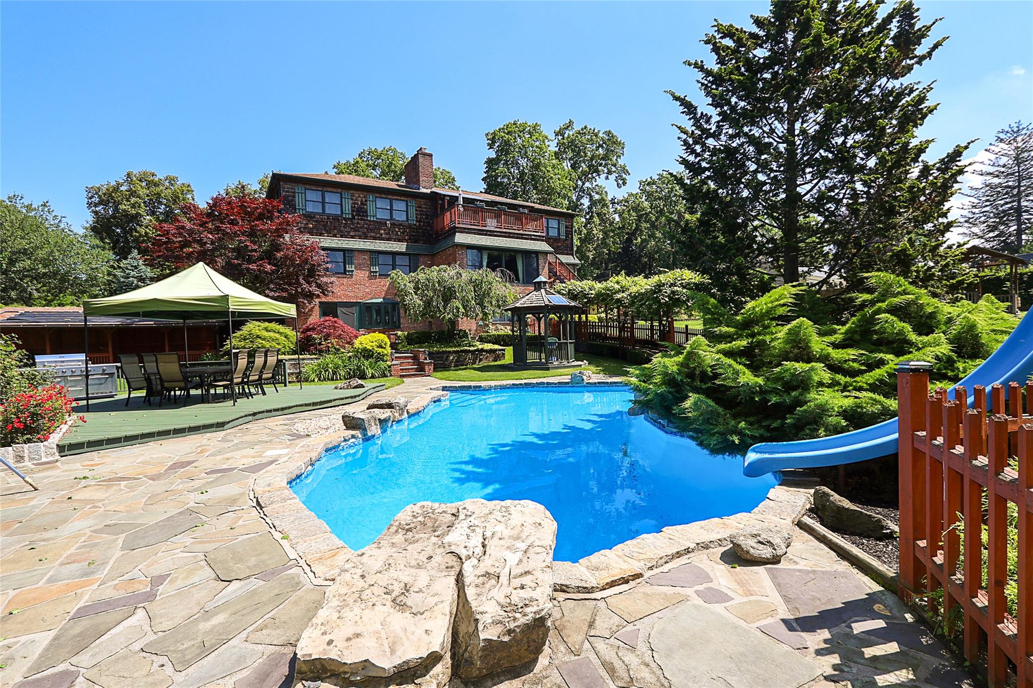 19 Marietta Road Glen Cove, NY 11542 - Photo 44 of 46 a view of a house with swimming pool and sitting area