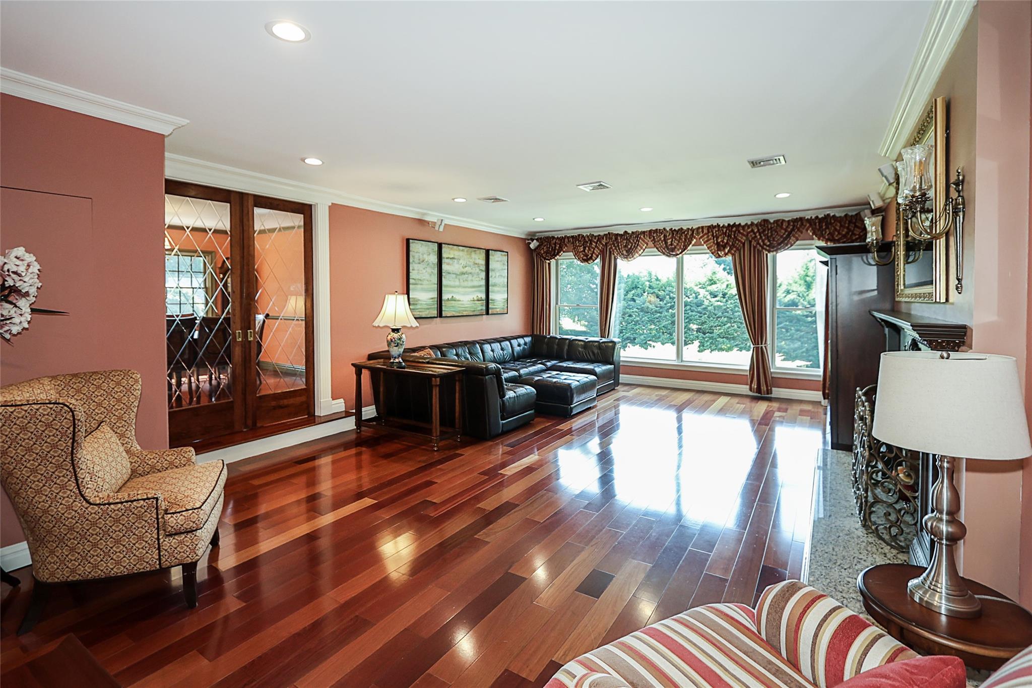 19 Marietta Road Glen Cove, NY 11542 - Photo 6 of 46 a living room with furniture floor to ceiling window and wooden floor
