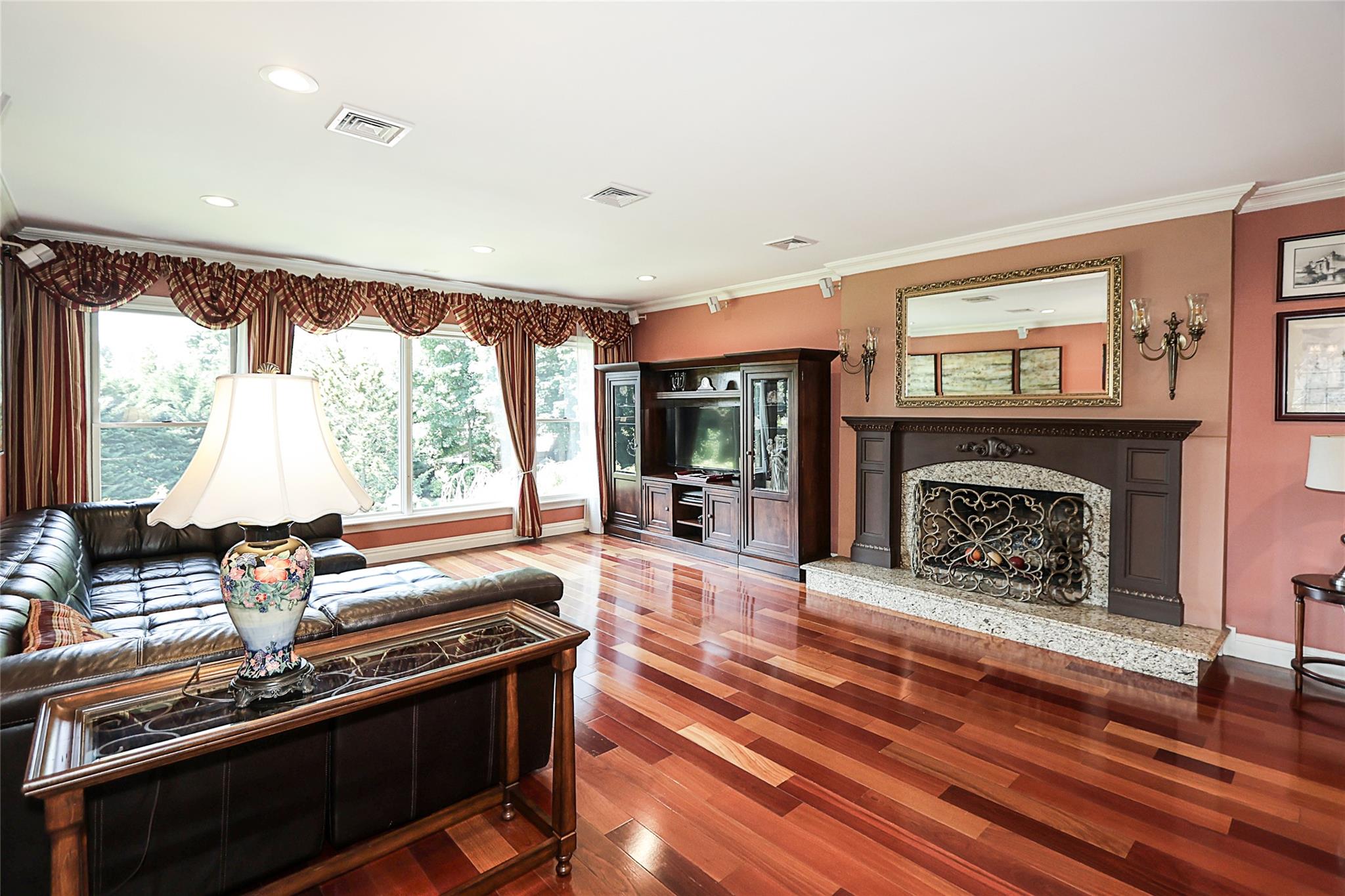 19 Marietta Road Glen Cove, NY 11542 - Photo 7 of 46 a living room with fireplace furniture and a fireplace