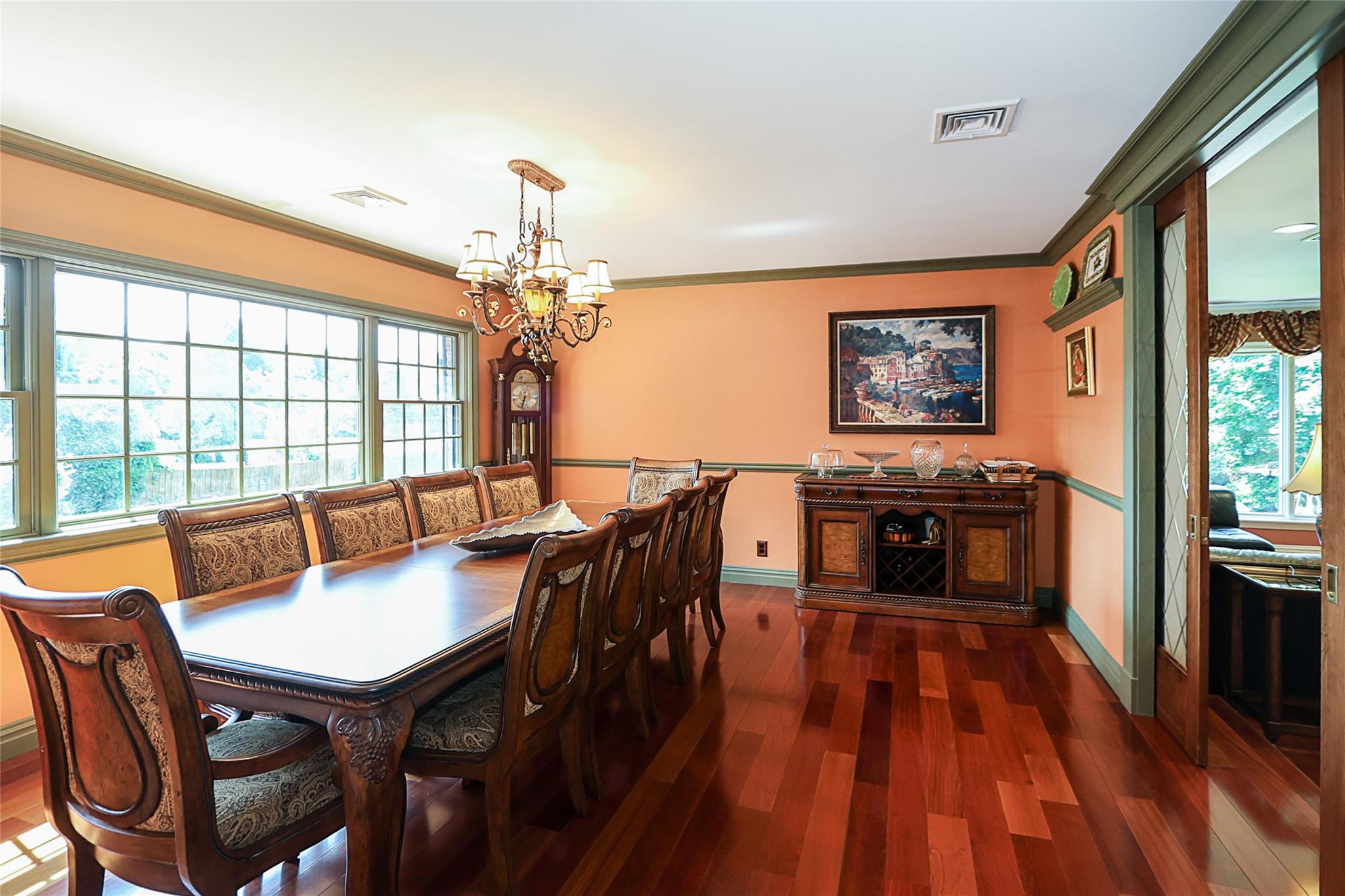 19 Marietta Road Glen Cove, NY 11542 - Photo 10 of 46 a dining room with furniture a chandelier and wooden floor