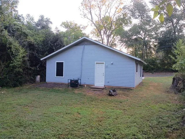 a view of a backyard of the house