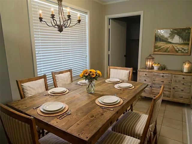 a dining room with furniture and wooden floor
