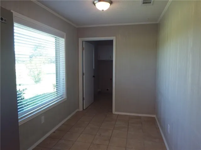 a view of an empty room and window