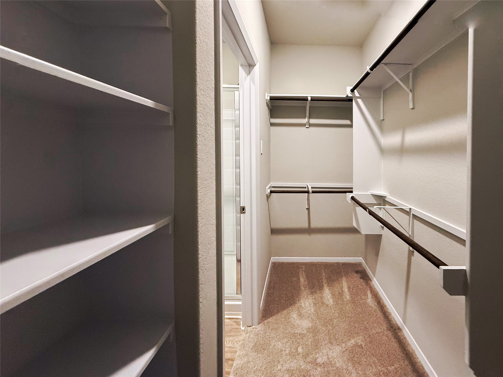 2714 Towy Road Manor, TX 78653 - Photo 12 of 22 Ample closet space with built-in shelving and convenient hanging rods provides generous storage solutions.
