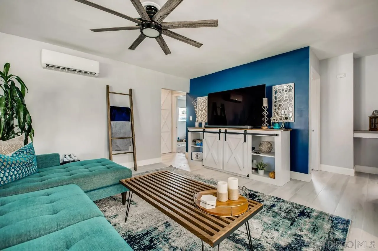 452 Concepcion Avenue Spring Valley, CA 91977 - Photo 5 of 25 a living room with furniture and a flat screen tv