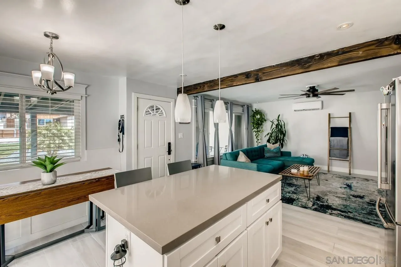 452 Concepcion Avenue Spring Valley, CA 91977 - Photo 9 of 25 a kitchen with a stove and a view of living room
