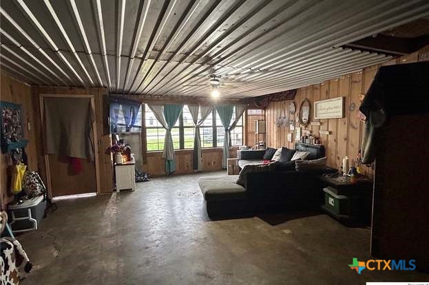 419 West Main Street Lometa, TX 76853 - Photo 3 of 16 a living room with furniture a flat screen tv and a large window