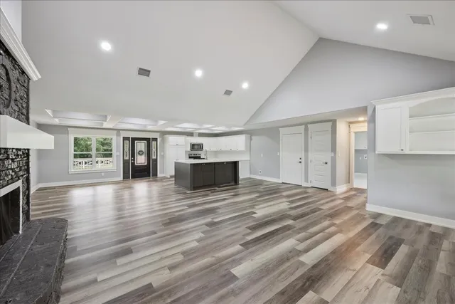 a kitchen with sink cabinets and wooden floor