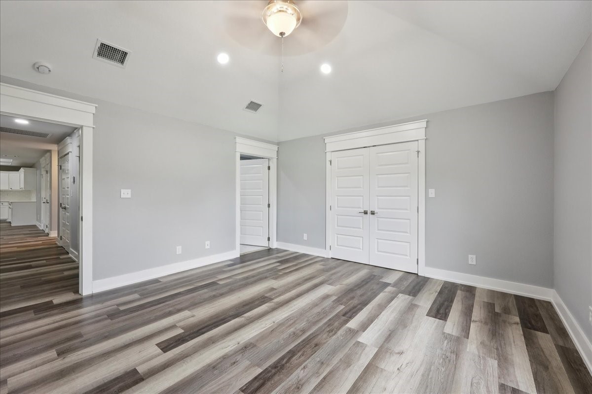 8679 Massey Lake Road Silsbee, TX 77656 - Photo 21 of 37 a view of an empty room and wooden floor