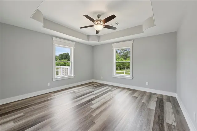 a view of porch with wooden floor and floor to ceiling window