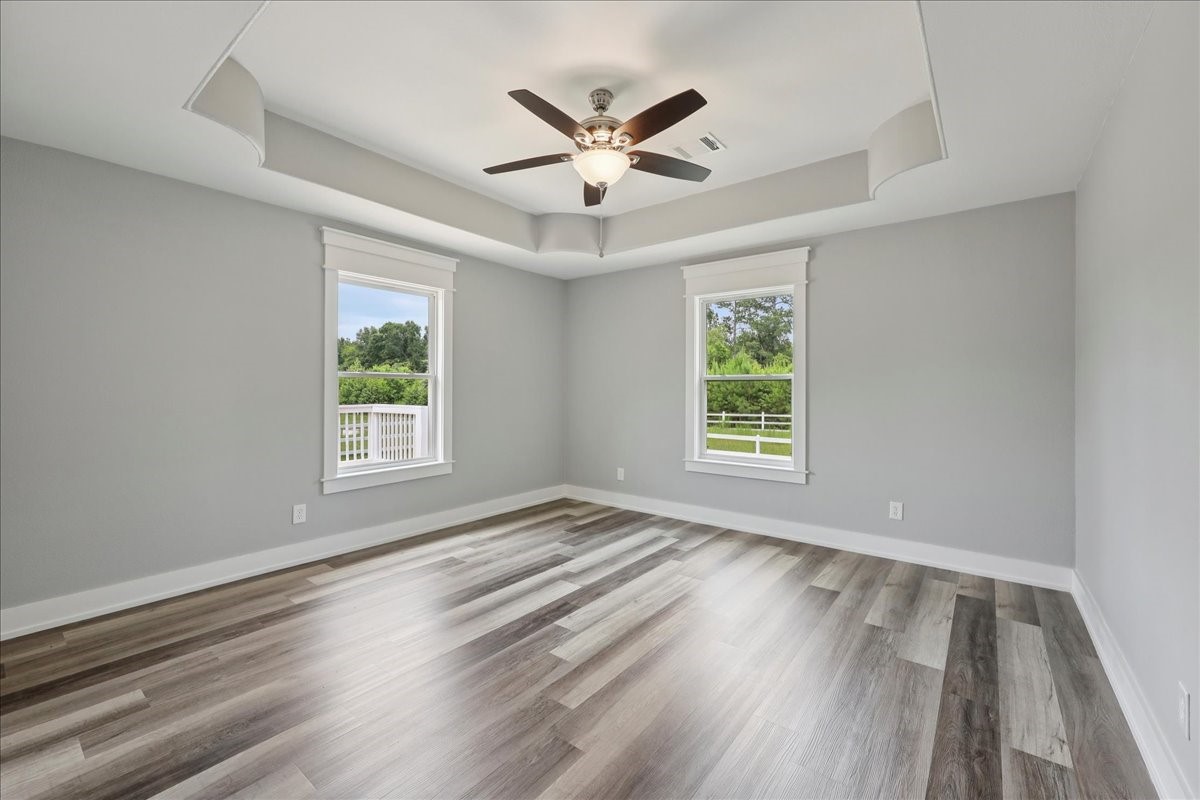 8679 Massey Lake Road Silsbee, TX 77656 - Photo 30 of 37 wooden floor in an empty room with a window