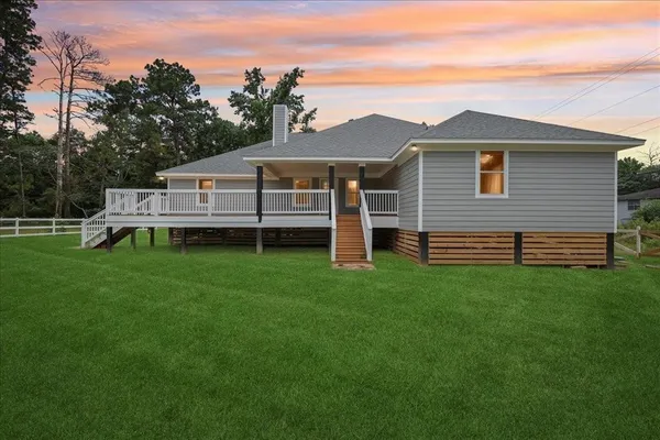 a view of a swimming pool with a yard and mountain view