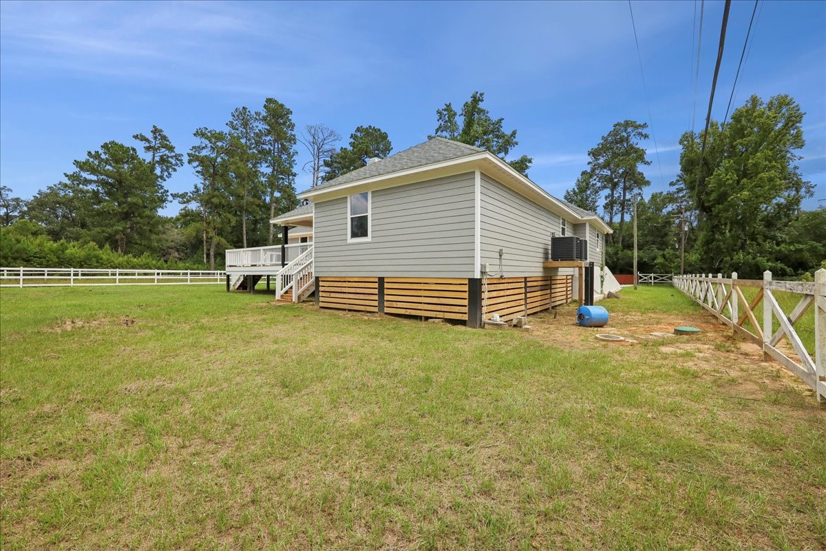 8679 Massey Lake Road Silsbee, TX 77656 - Photo 34 of 37 a view of a house with a yard and a garden