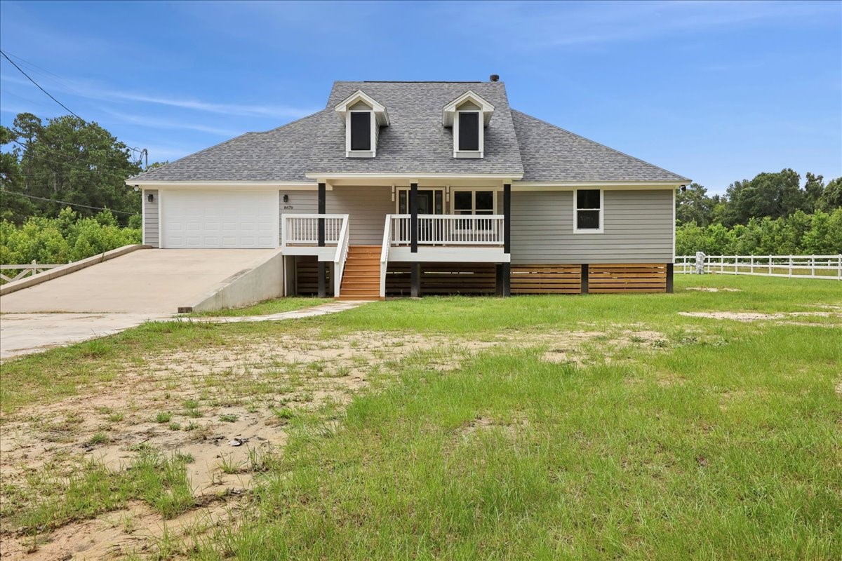 8679 Massey Lake Road Silsbee, TX 77656 - Photo 36 of 37 a front view of a house with a yard