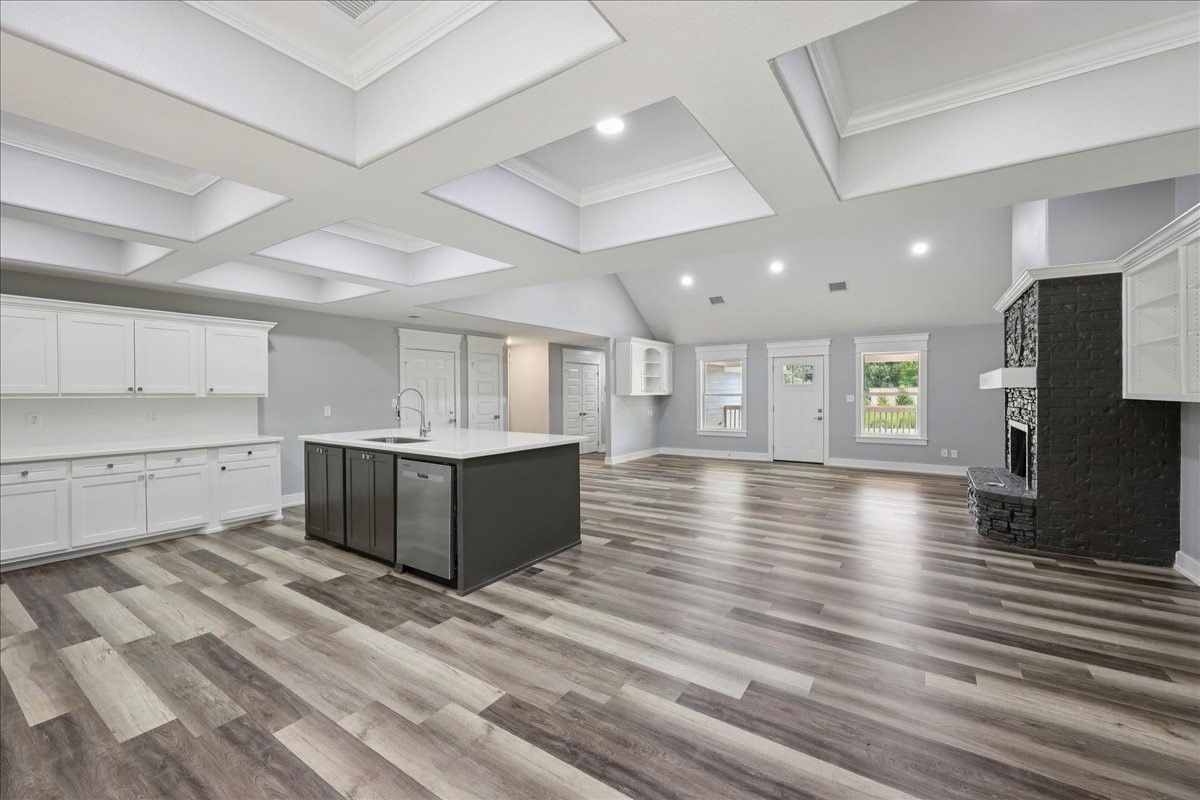 8679 Massey Lake Road Silsbee, TX 77656 - Photo 10 of 37 a view of a kitchen with center island and wooden floor