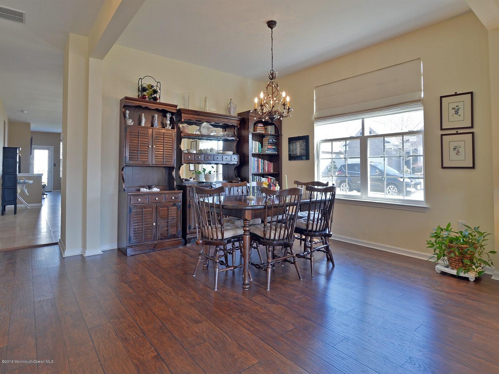 33 Criollo Road Manalapan, NJ 07726 - Photo 4 of 22 a view of a dining room with furniture window and wooden floor