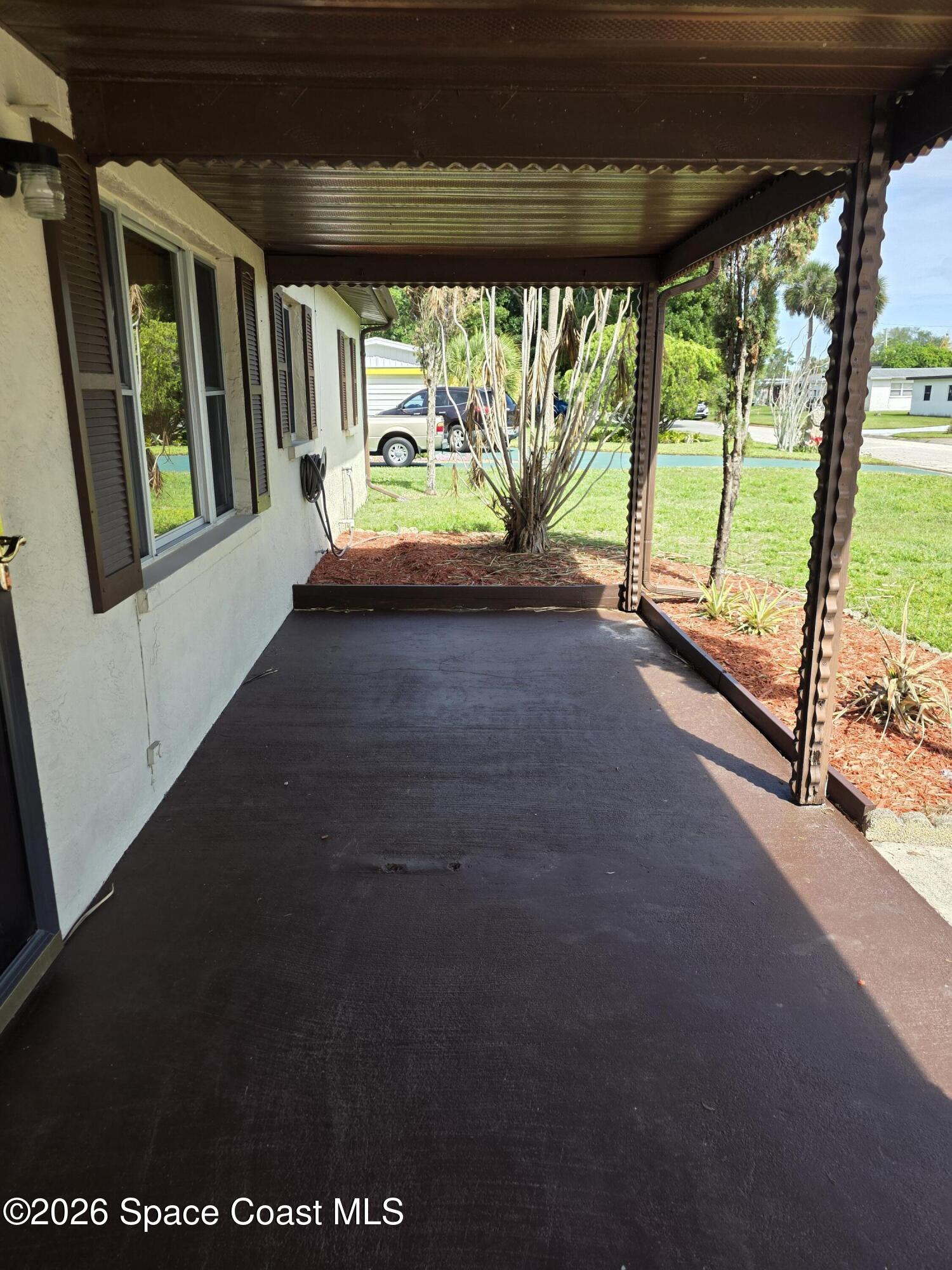 2910 Zephyr Lane Melbourne, FL 32935 - Photo 13 of 16 a view of an empty room with a large window