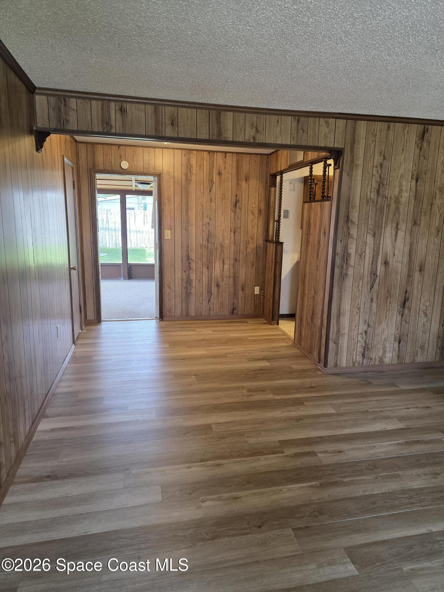 2910 Zephyr Lane Melbourne, FL 32935 - Photo 6 of 16 a view of entryway with wooden floor