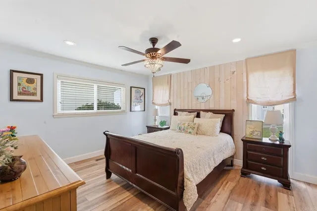 a bedroom with a bed and a table in it