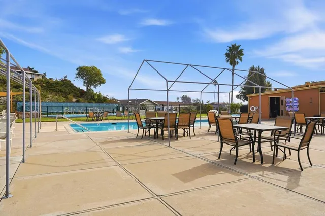a view of a patio with a table and chairs