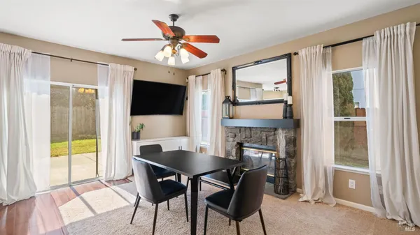 a view of a dining room with furniture window and outside view