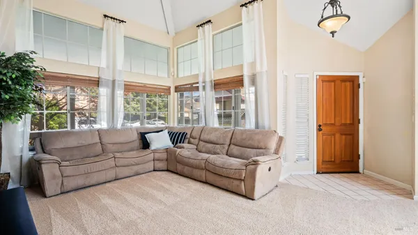 a living room with furniture and a large window