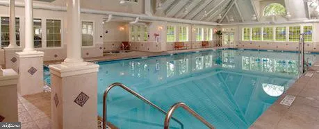 a view of tennis court with trees in the background