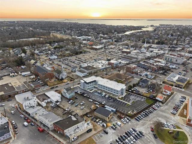 an aerial view of residential houses with city view