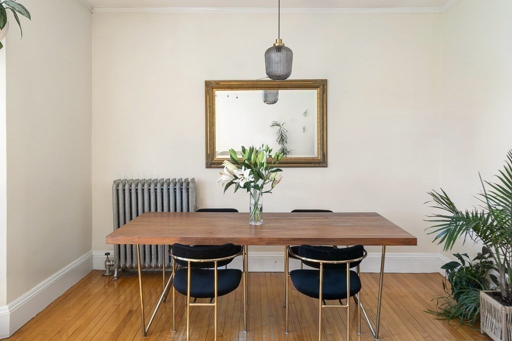 231 Rawson Road, Unit 6 Brookline, MA 02445 - Photo 5 of 11 a view of a dining room with furniture and wooden floor