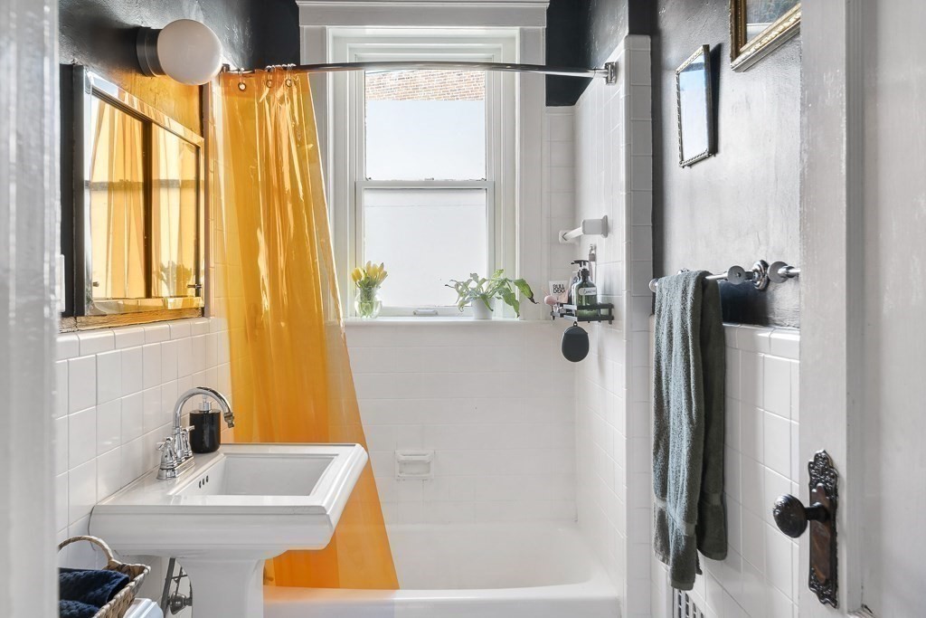 231 Rawson Road, Unit 6 Brookline, MA 02445 - Photo 10 of 11 a bathroom with a tub and a sink