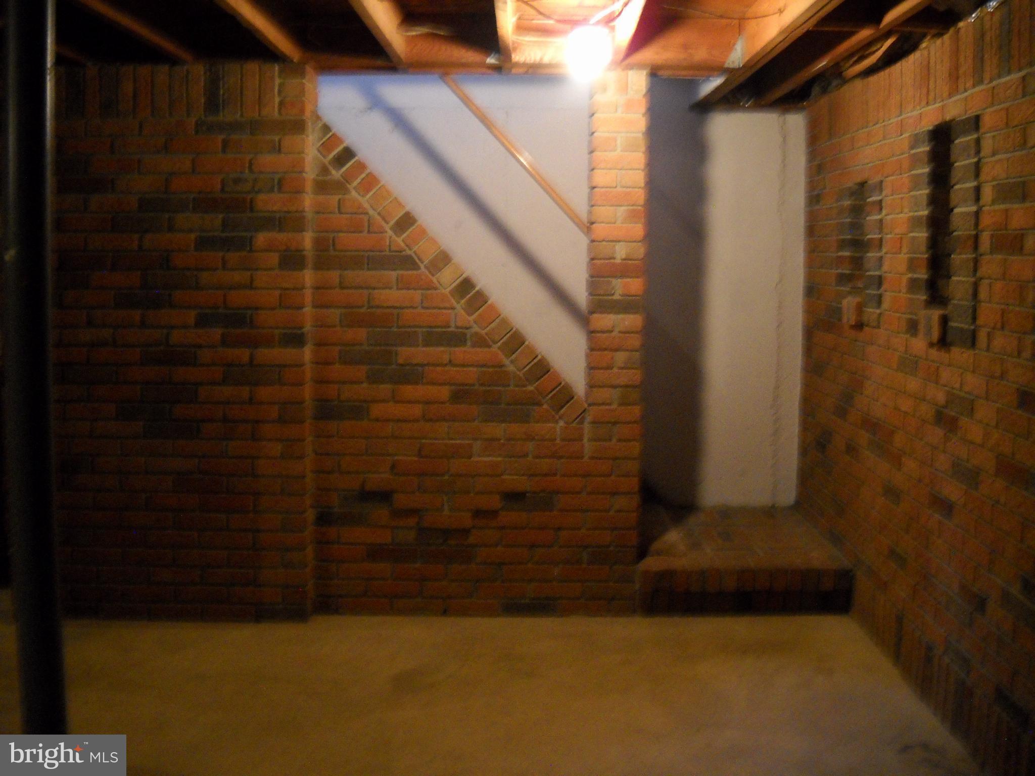6215 Auth Road Suitland, MD 20746 - Photo 17 of 21 Bricked walls in basement