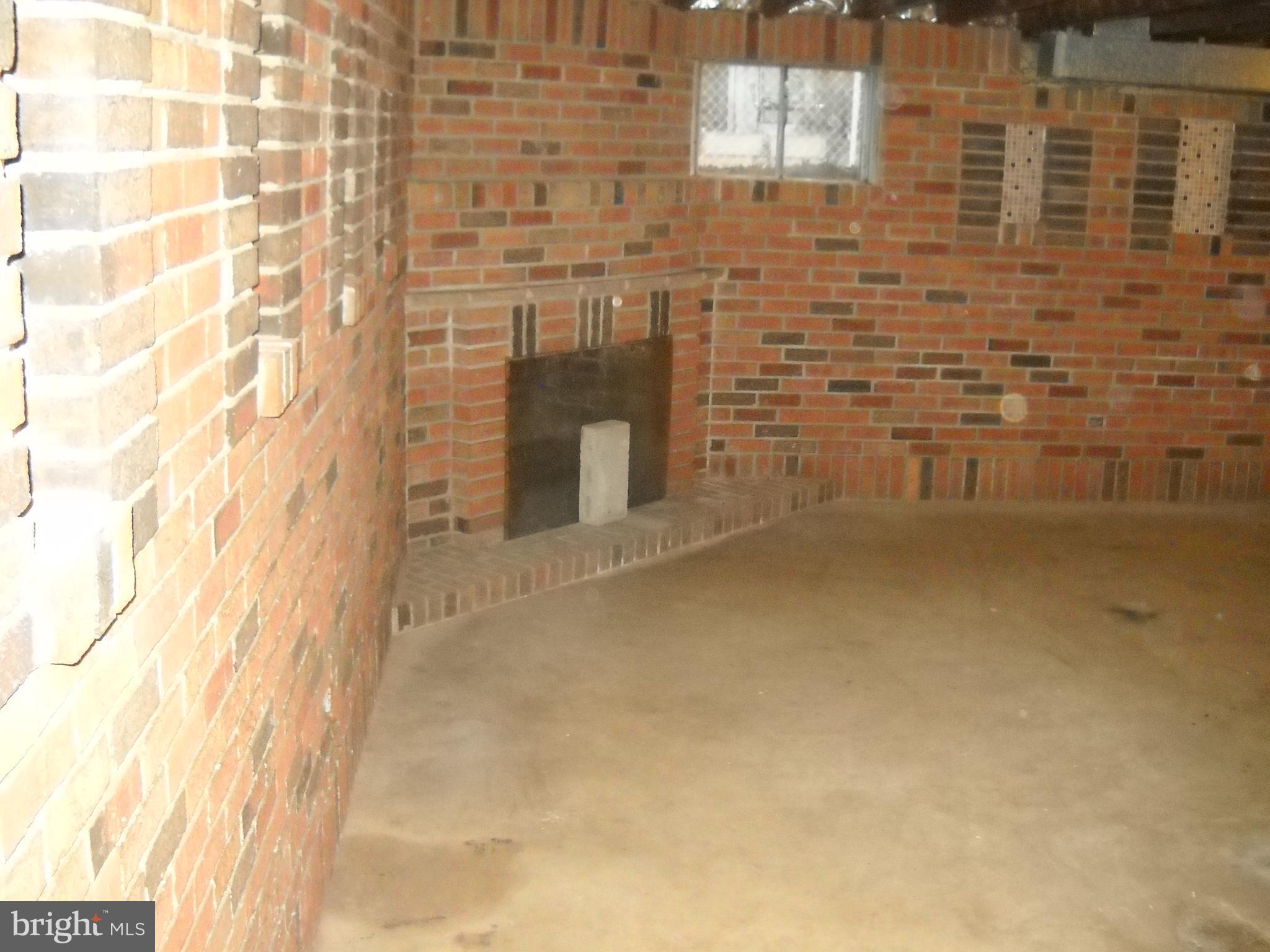 6215 Auth Road Suitland, MD 20746 - Photo 18 of 21 Nice fireplace in basement