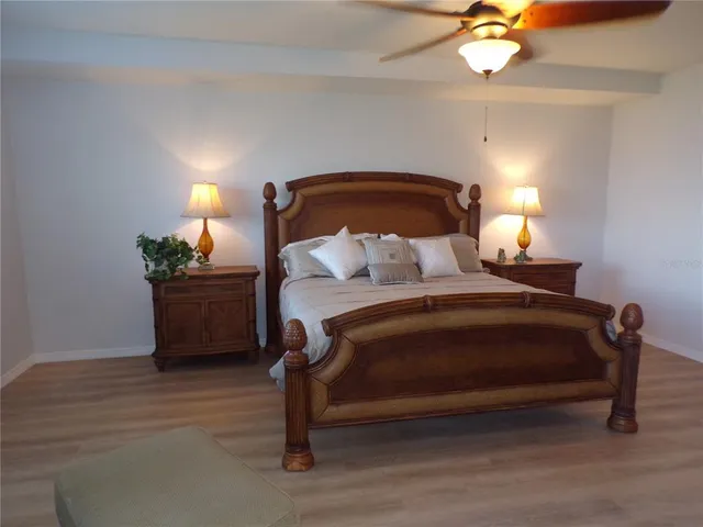 a living room with furniture and a lamp