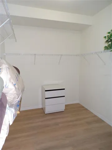 a view of a livingroom with furniture and a window