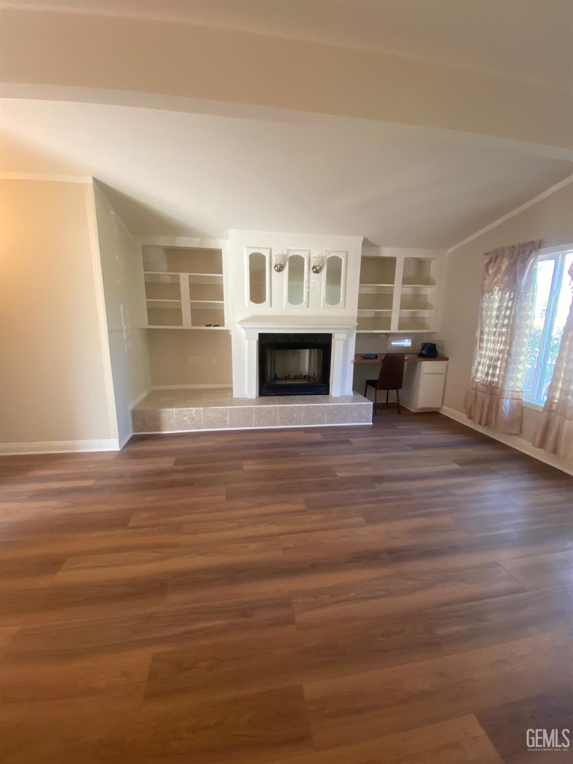 Undisclosed Address Santa Ana, CA 92707 - Photo 16 of 40 wooden floor fireplace and windows in an empty room