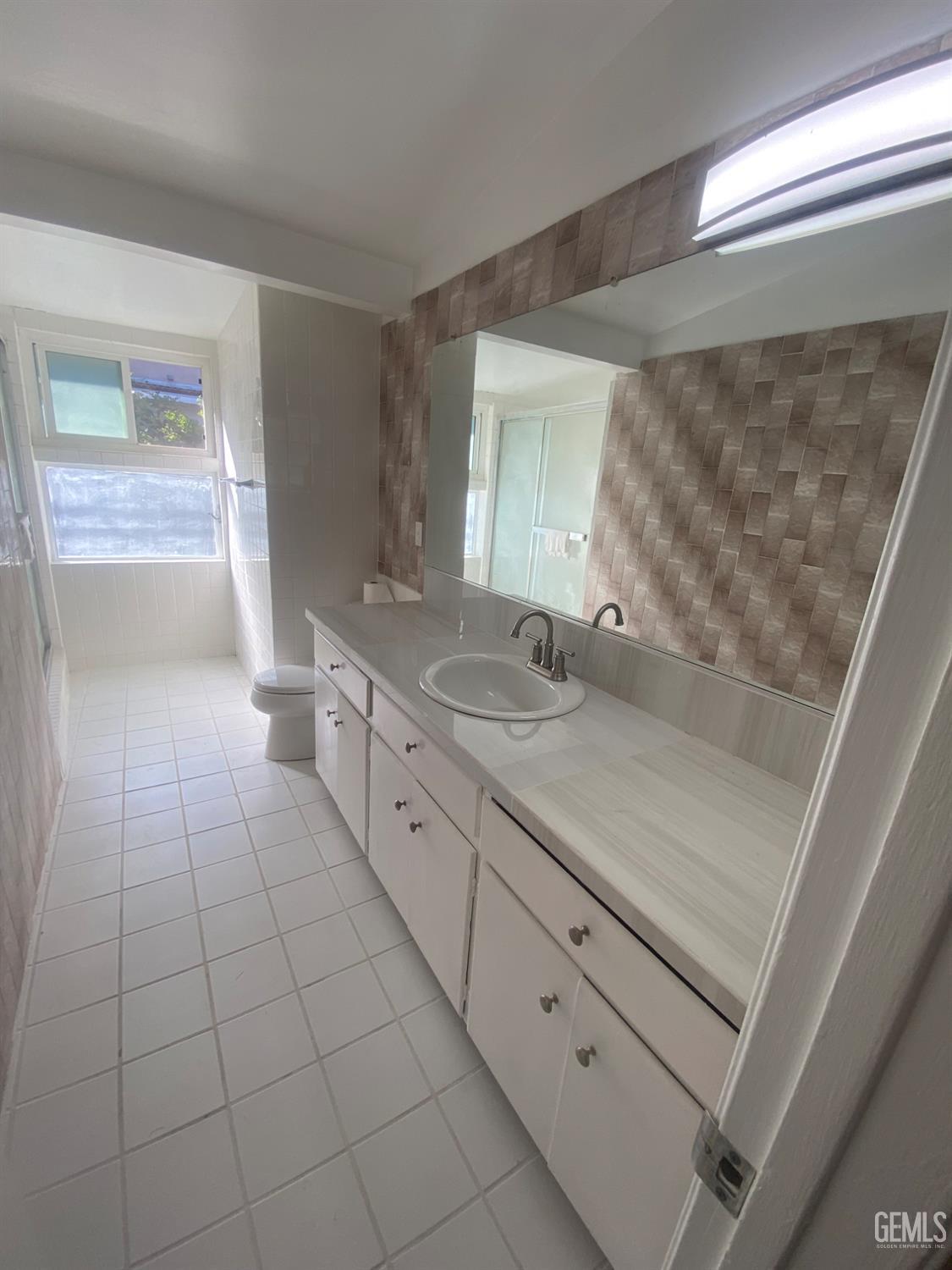 Undisclosed Address Santa Ana, CA 92707 - Photo 22 of 40 a bathroom with a sink and a mirror