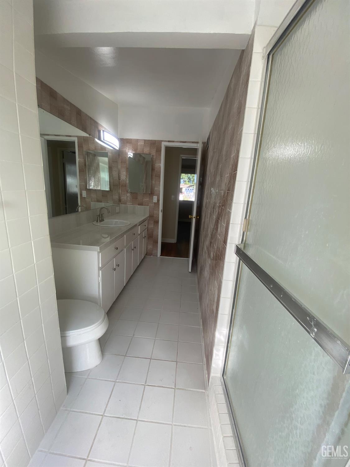 Undisclosed Address Santa Ana, CA 92707 - Photo 27 of 40 a bathroom with a sink a toilet and a shower